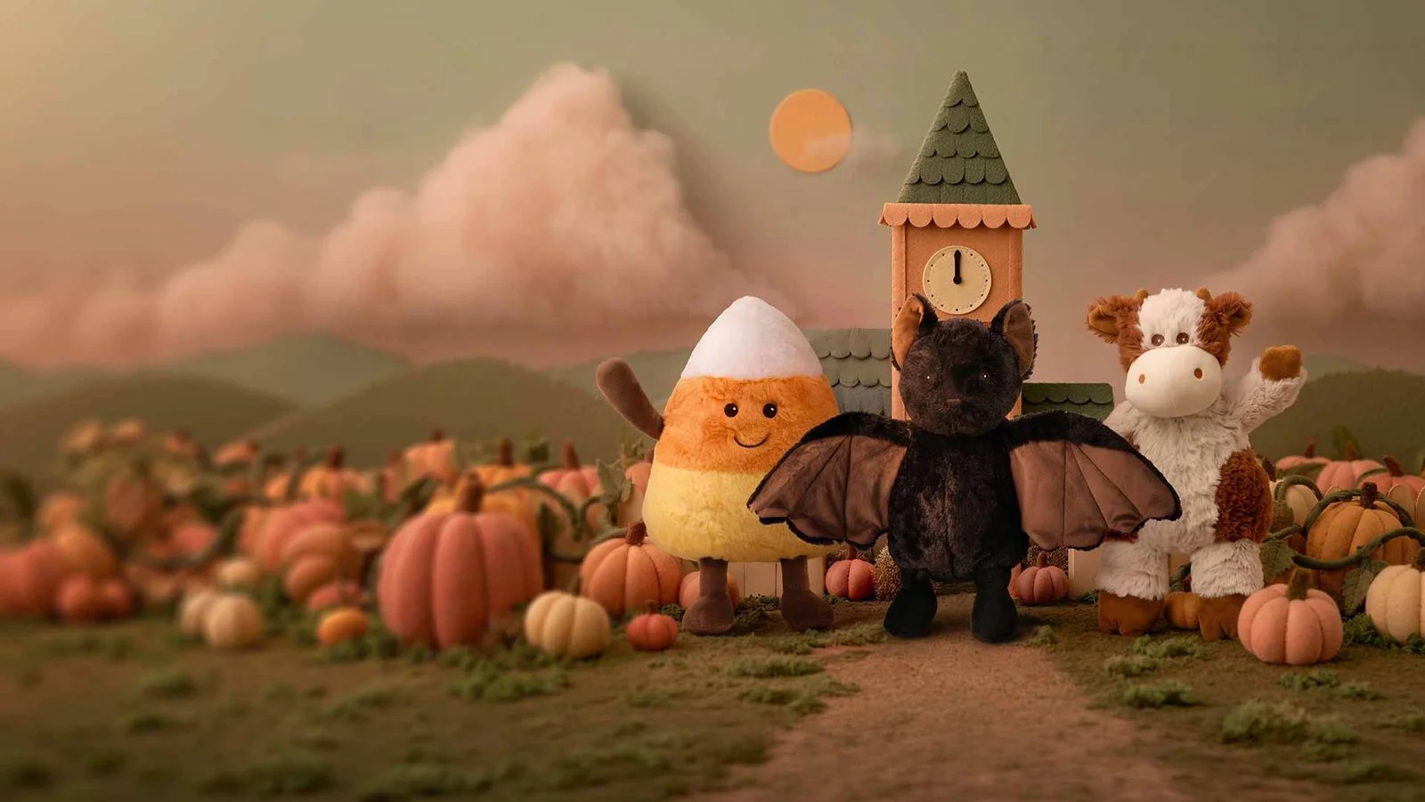 Des peluches douces dans un décor de citrouilles